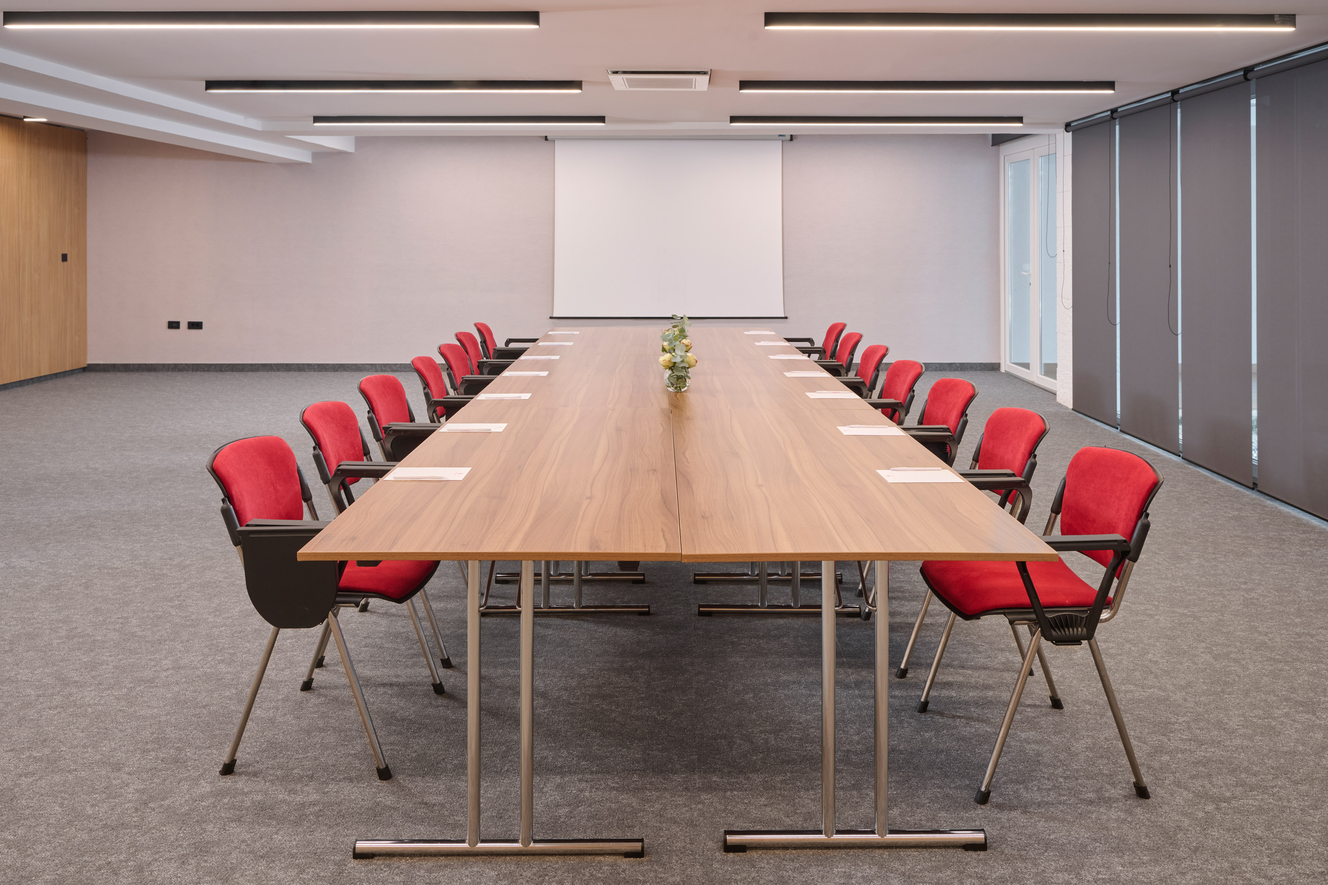 a conference room with a table and chairs