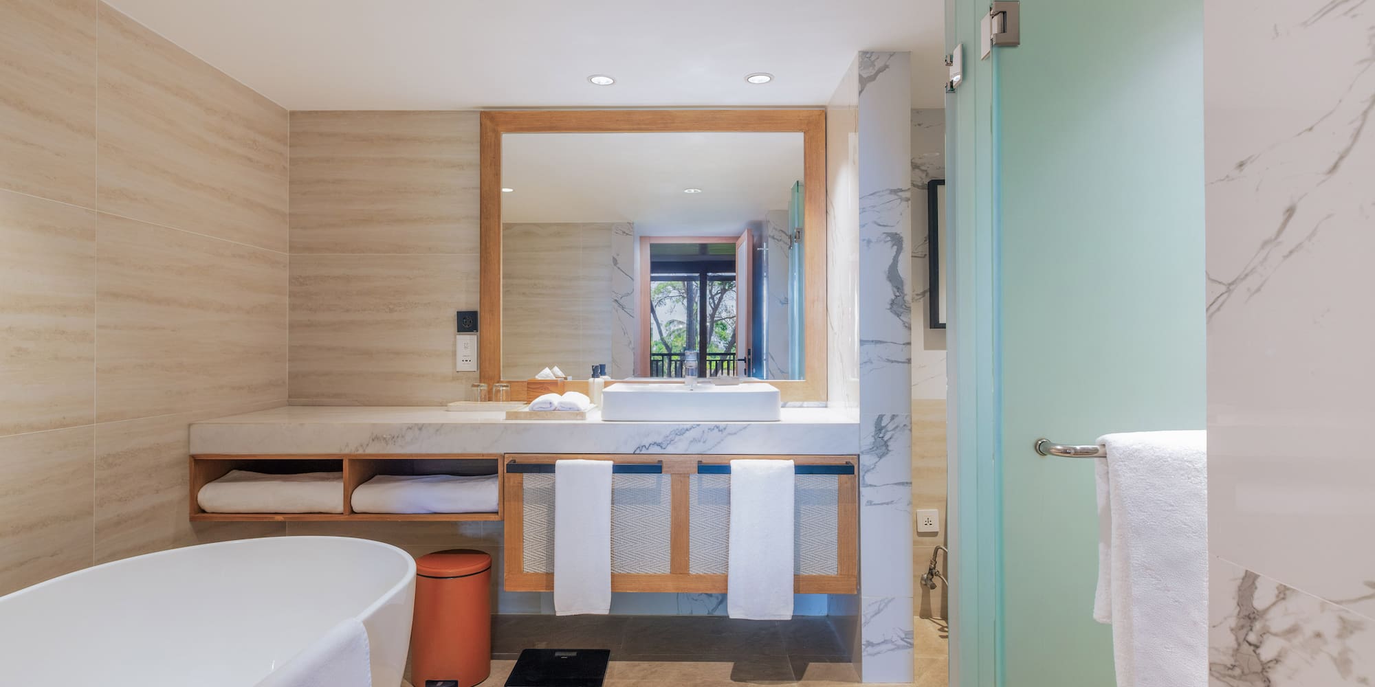 a bathroom with a mirror and sink