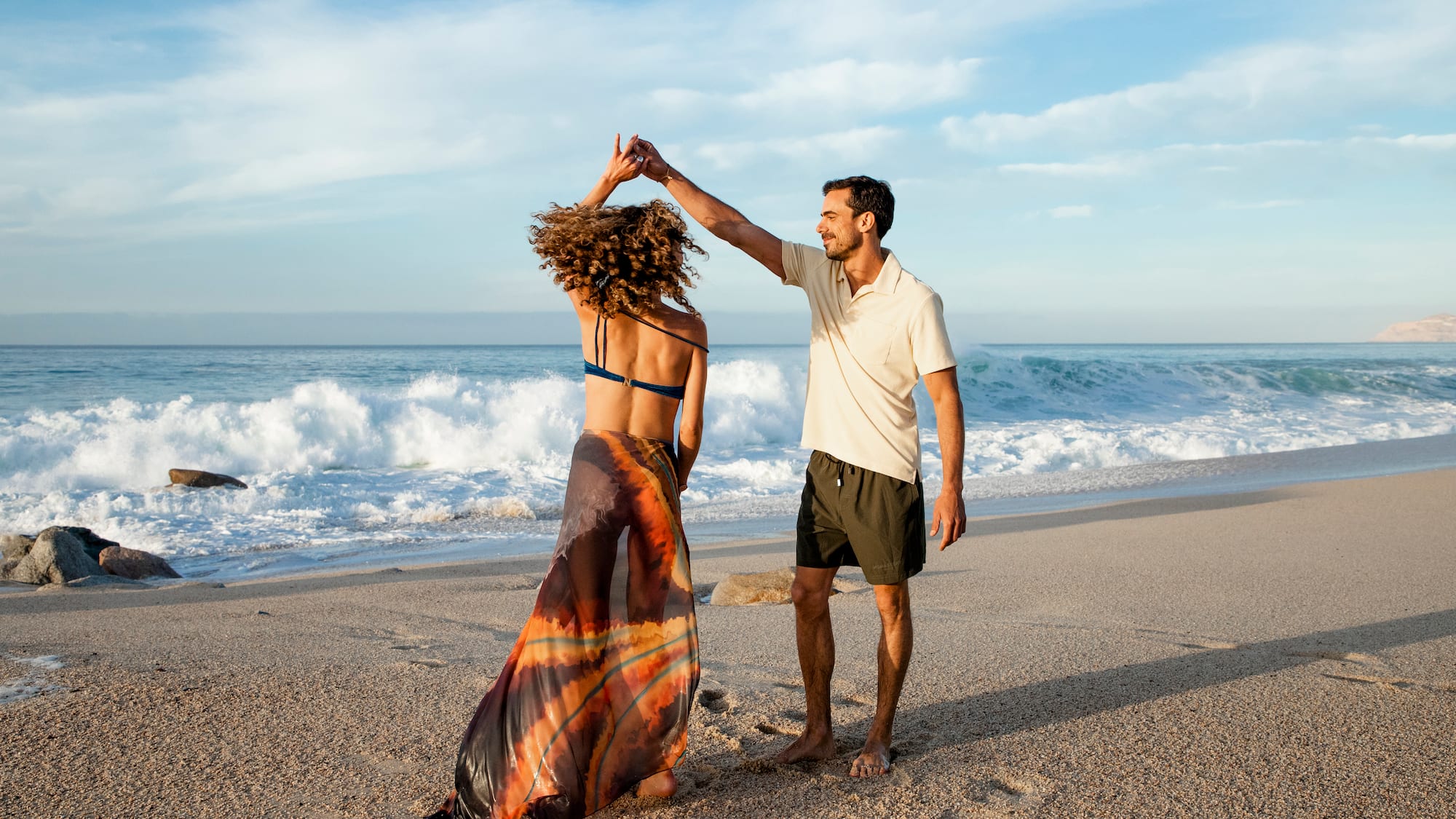 a man and woman on a beach