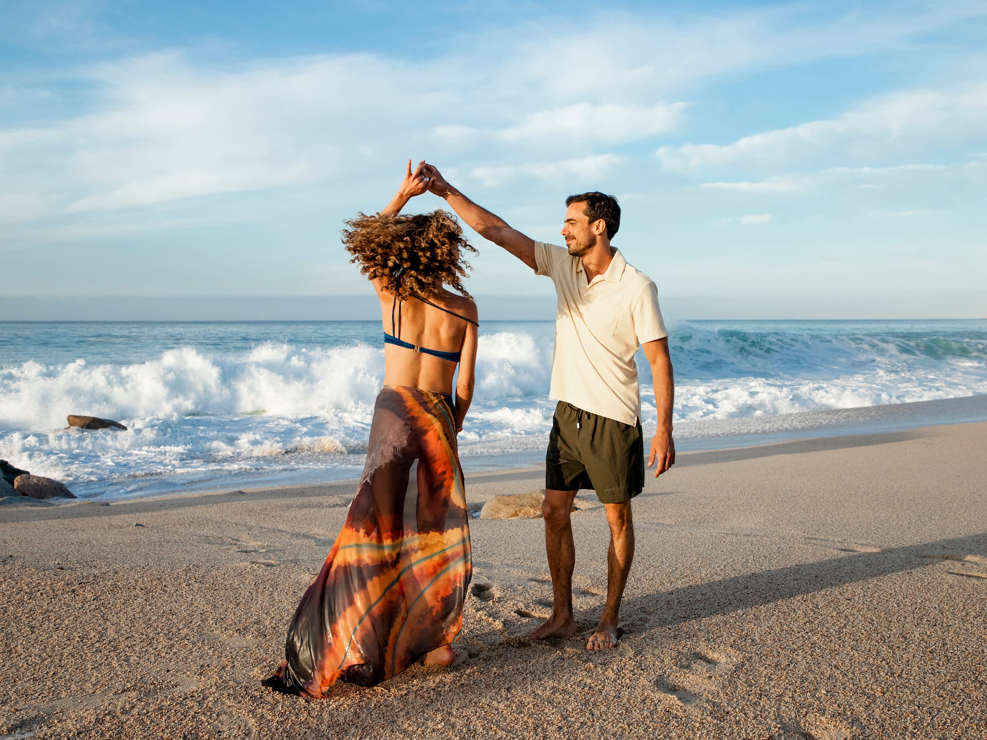 a man and woman on a beach