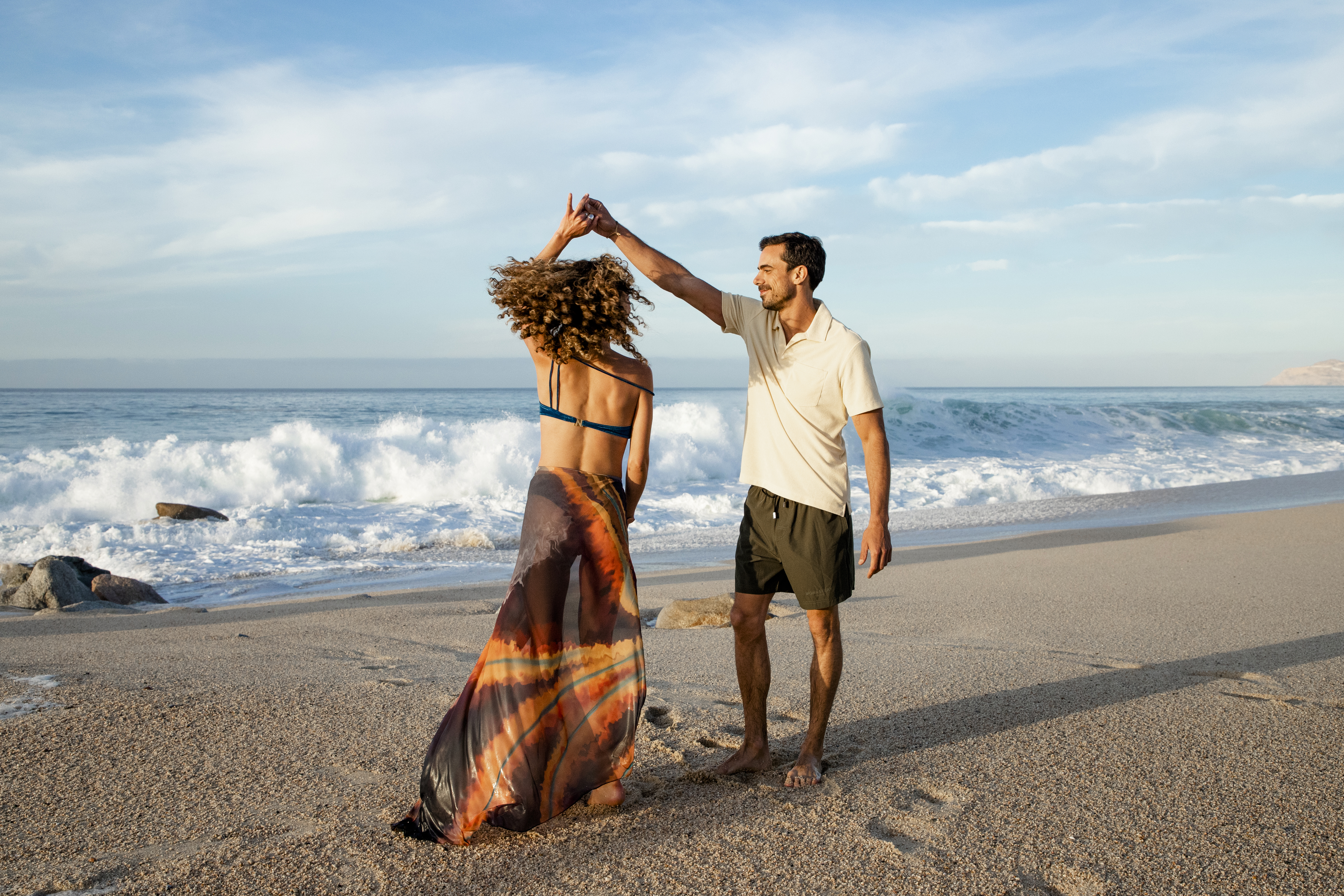 a man and woman on a beach