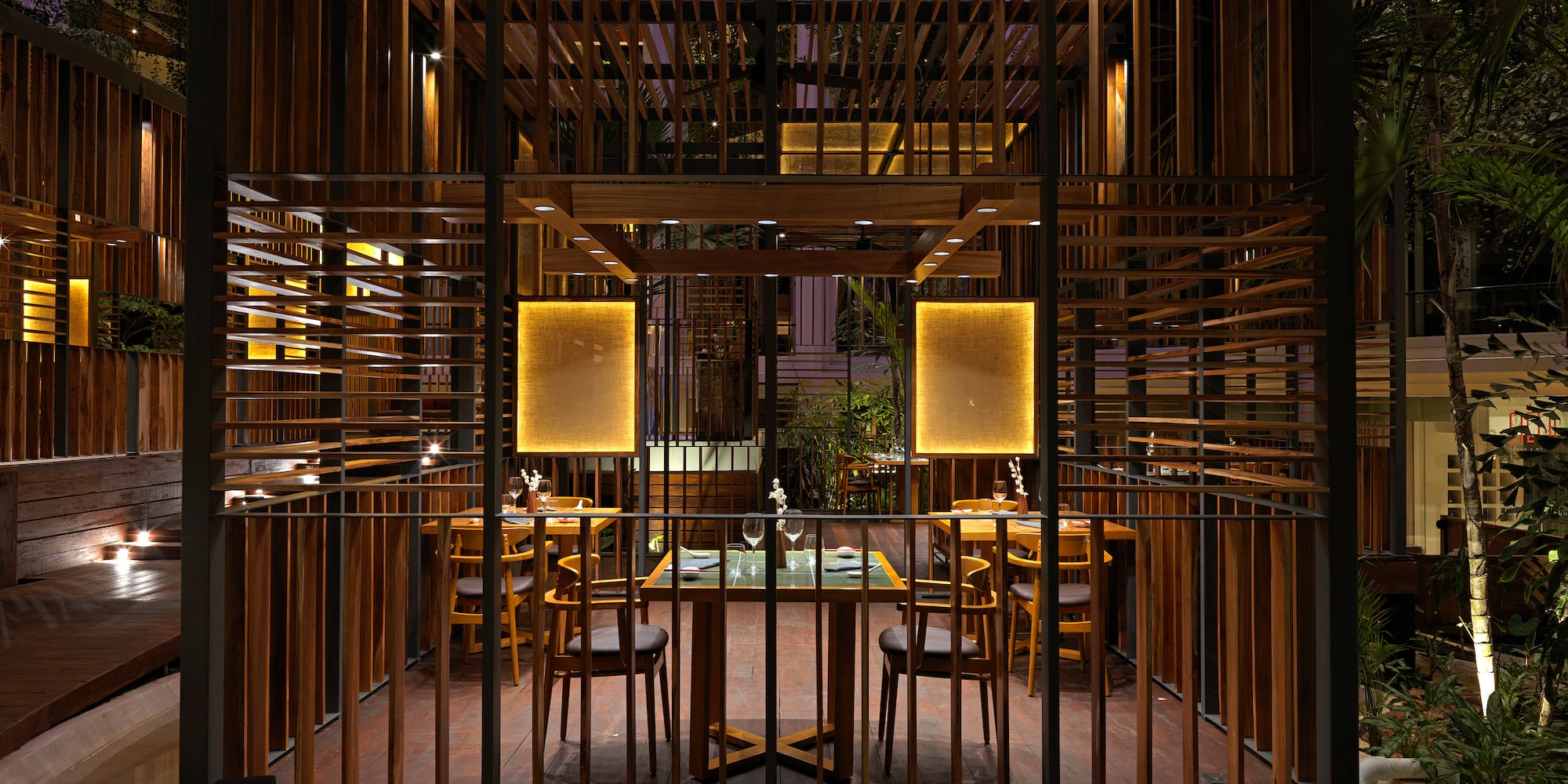 a wooden structure with a table and chairs