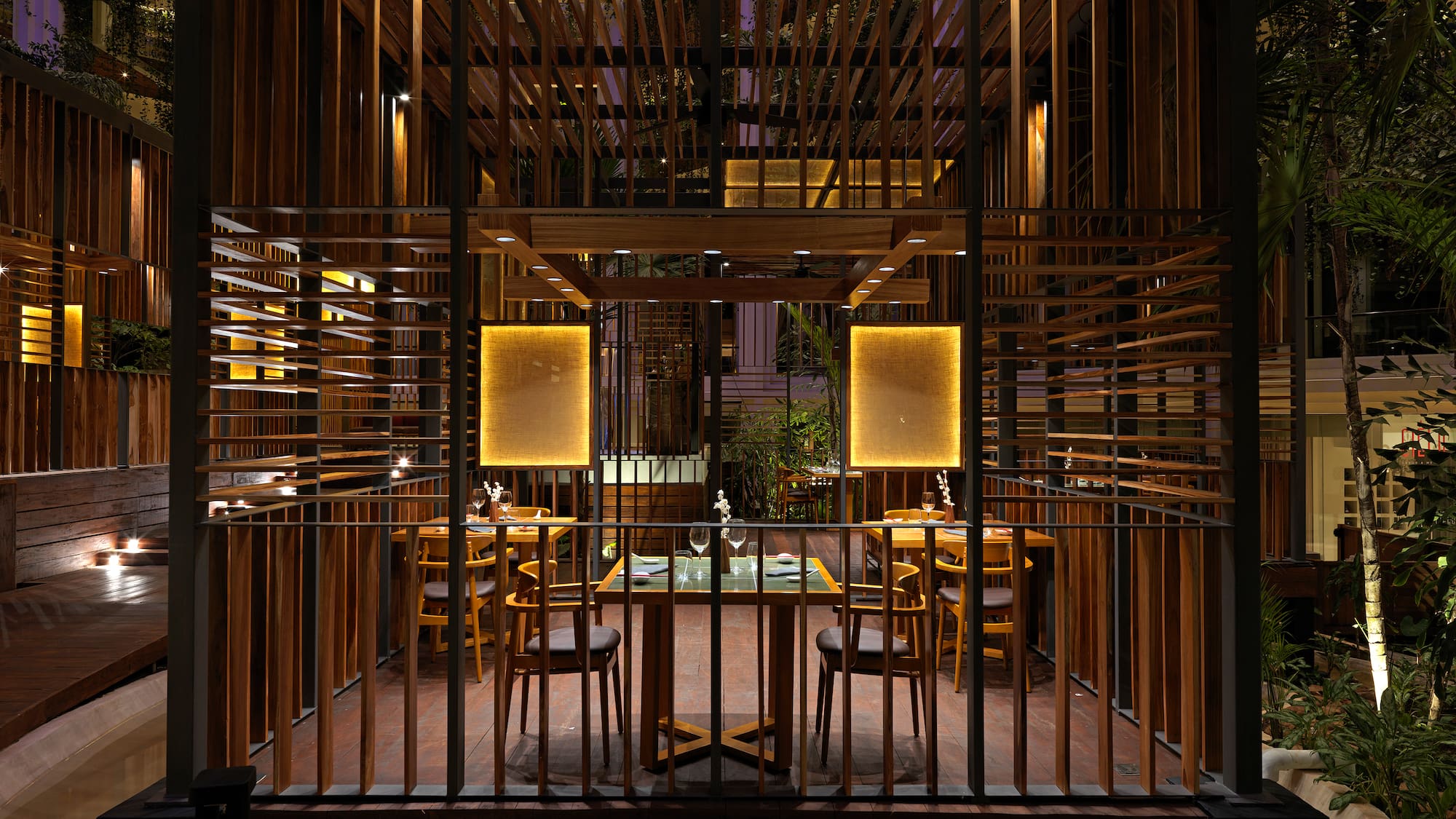 a wooden structure with a table and chairs