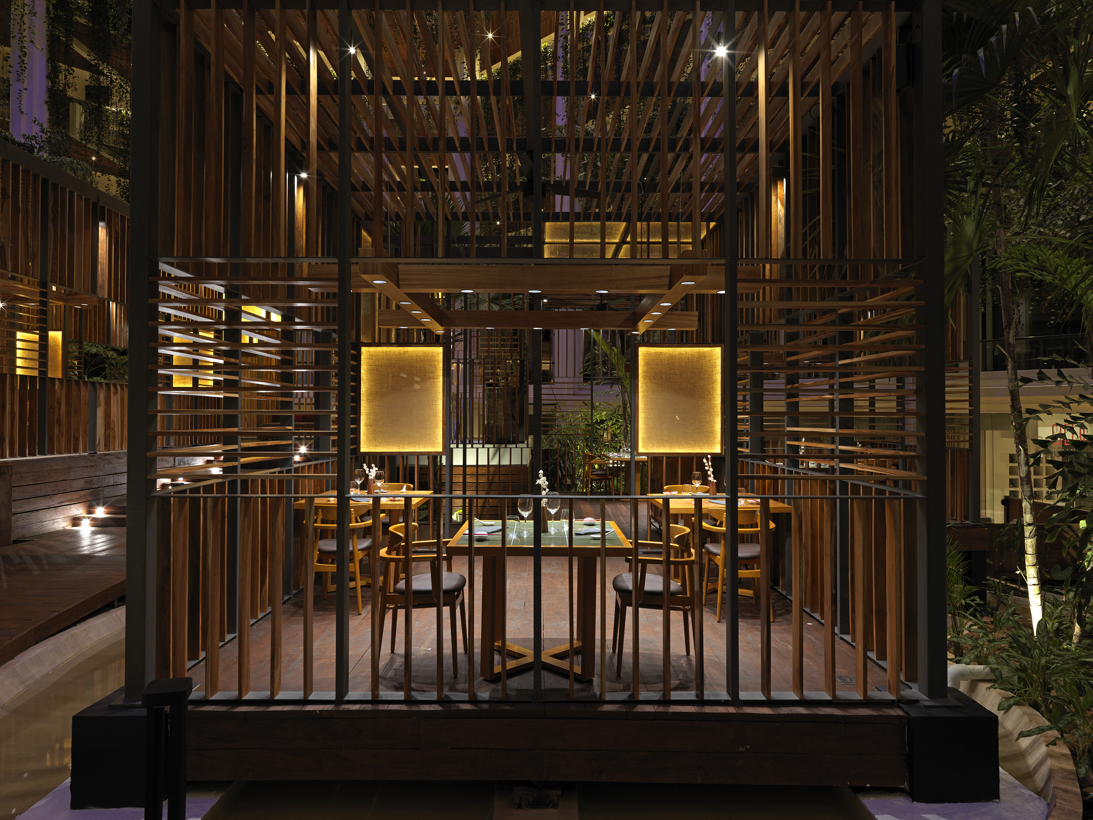 a wooden structure with a table and chairs