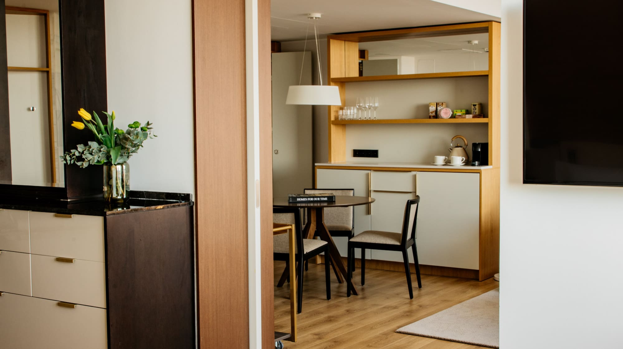 a room with a tv and a bag