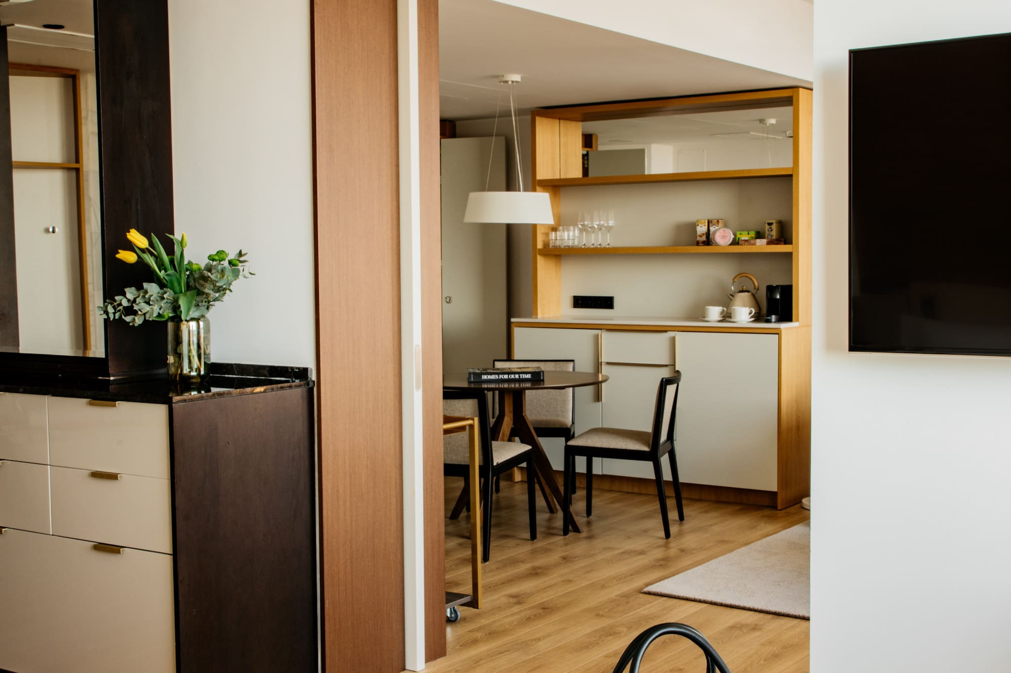 a room with a tv and a bag