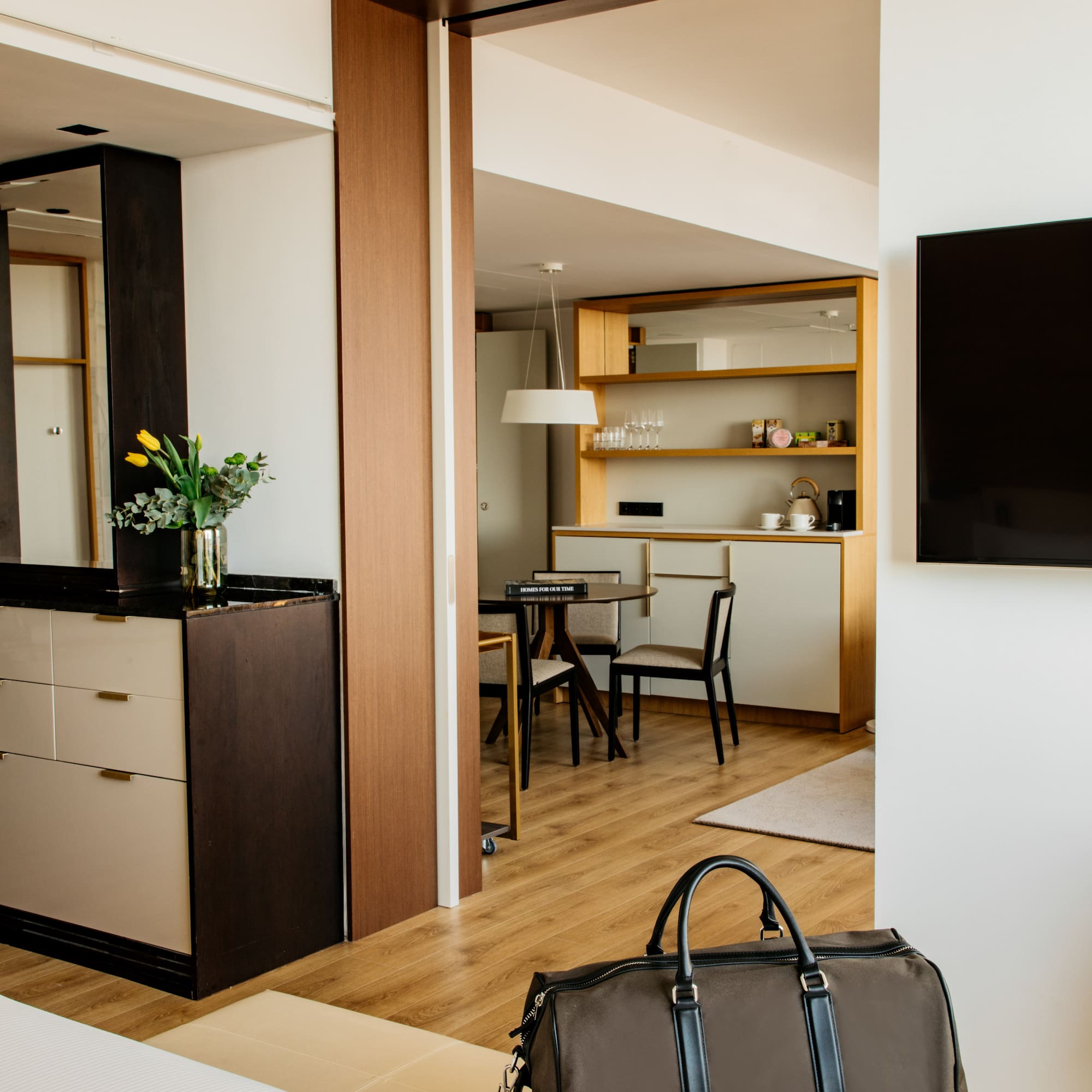 a room with a tv and a bag