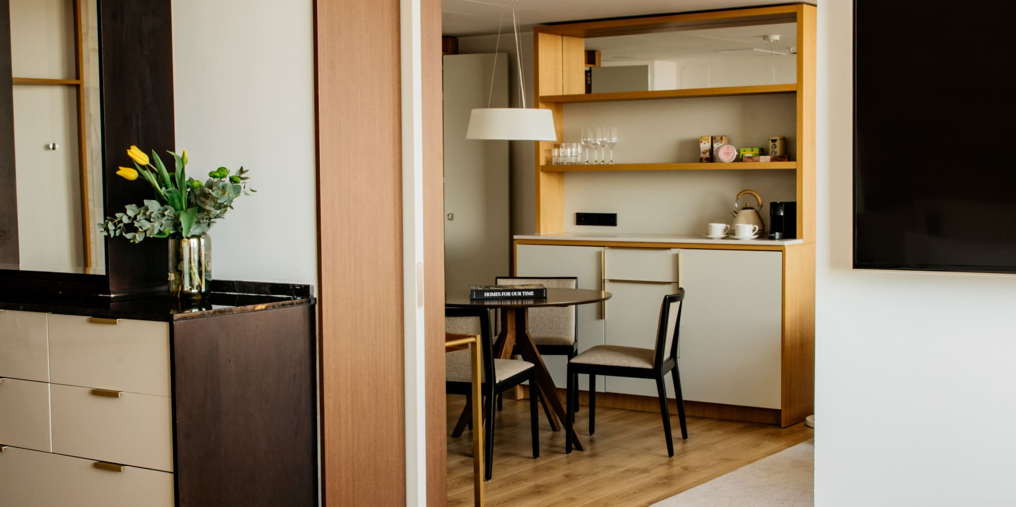 a room with a tv and a bag