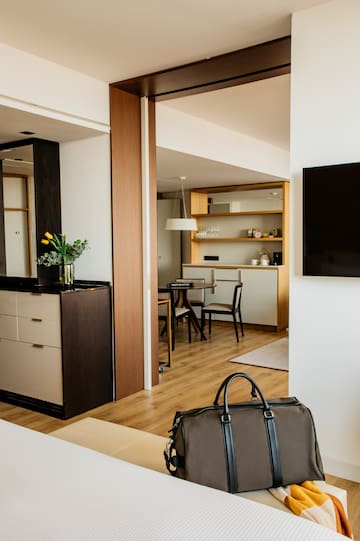 a room with a tv and a bag