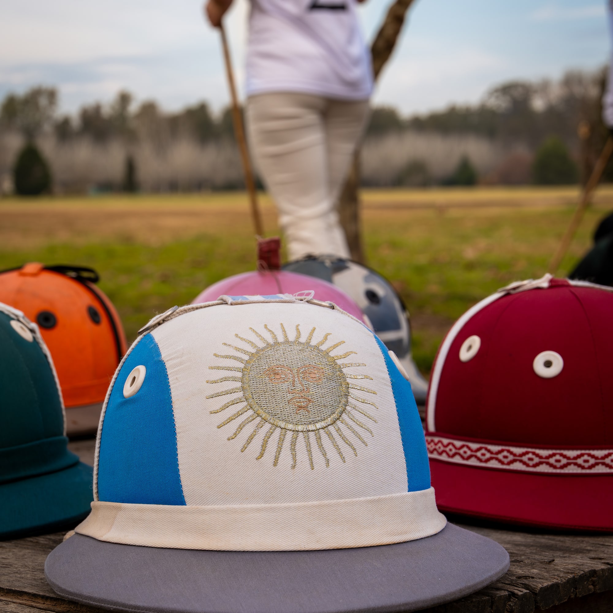 a group of hats on a wood surface