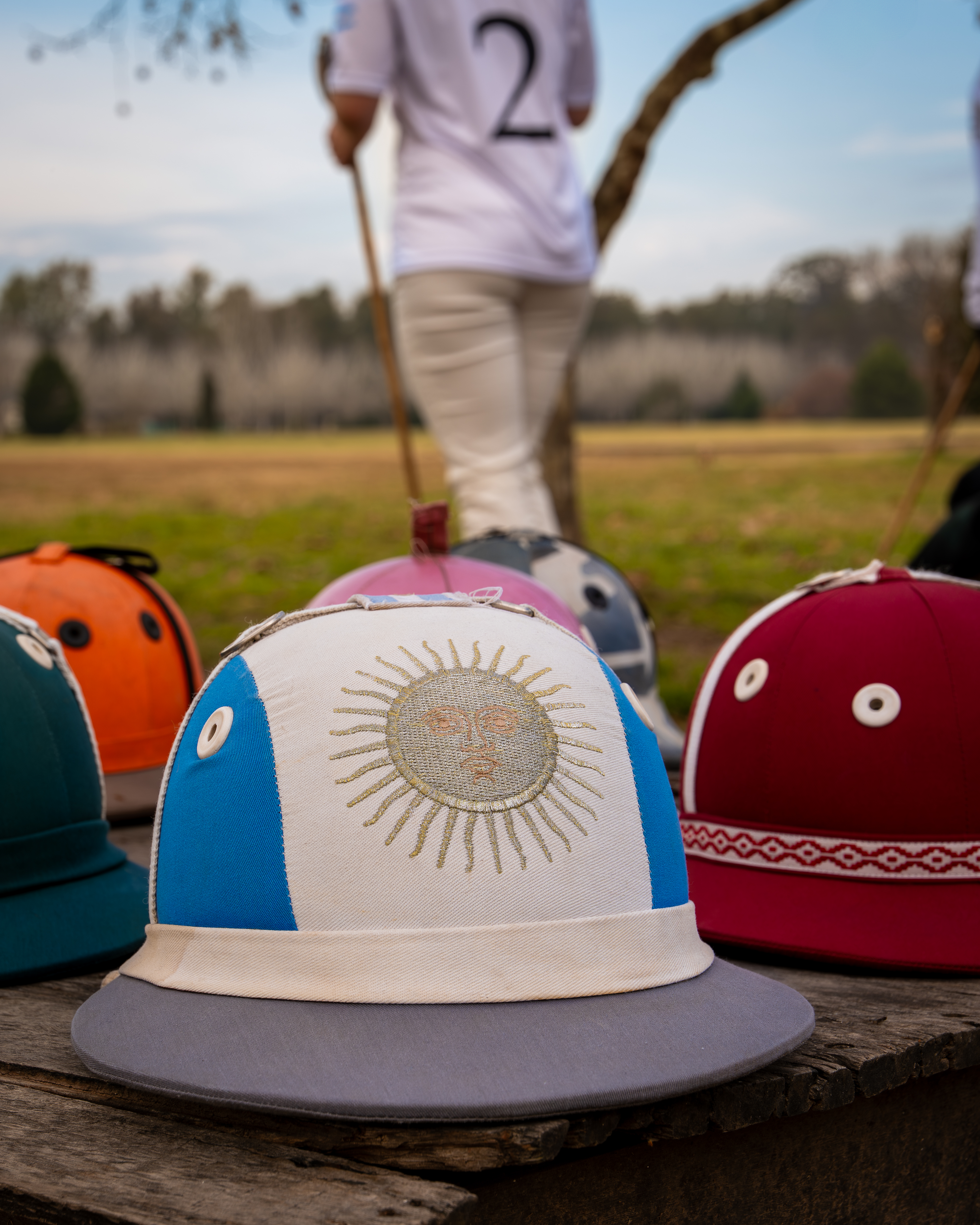 a group of hats on a wood surface