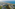 Aerial view: Oceanfront resort villas, canals, and lush tropical landscaping.