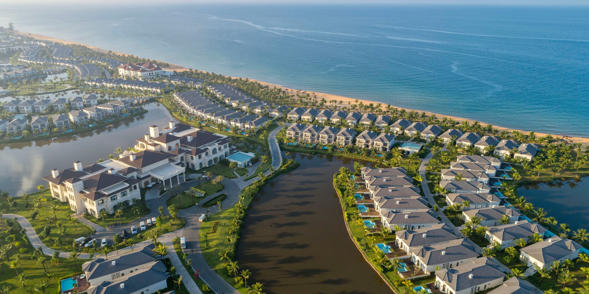 a group of houses next to a body of water