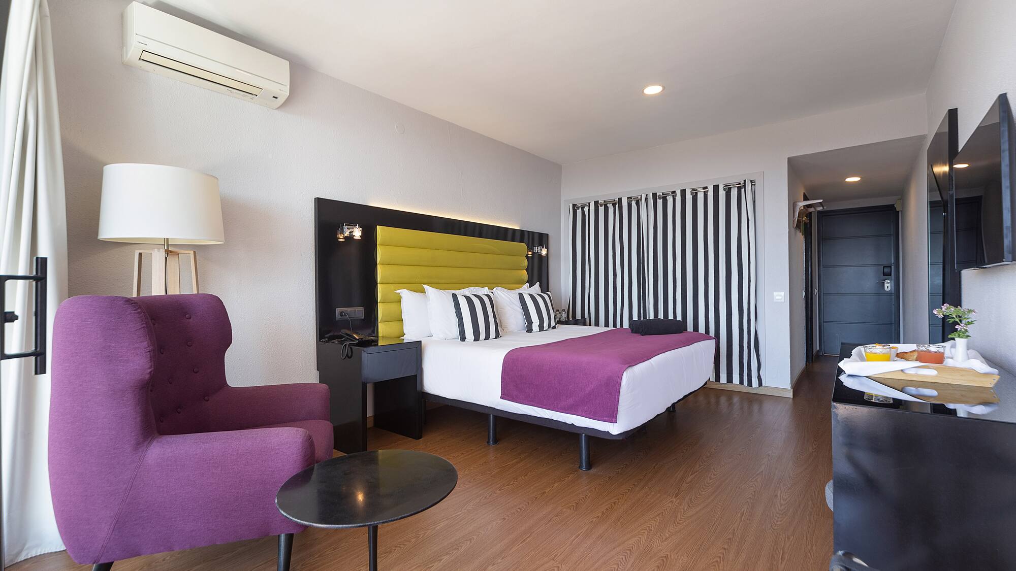 a room with a bed and a chair