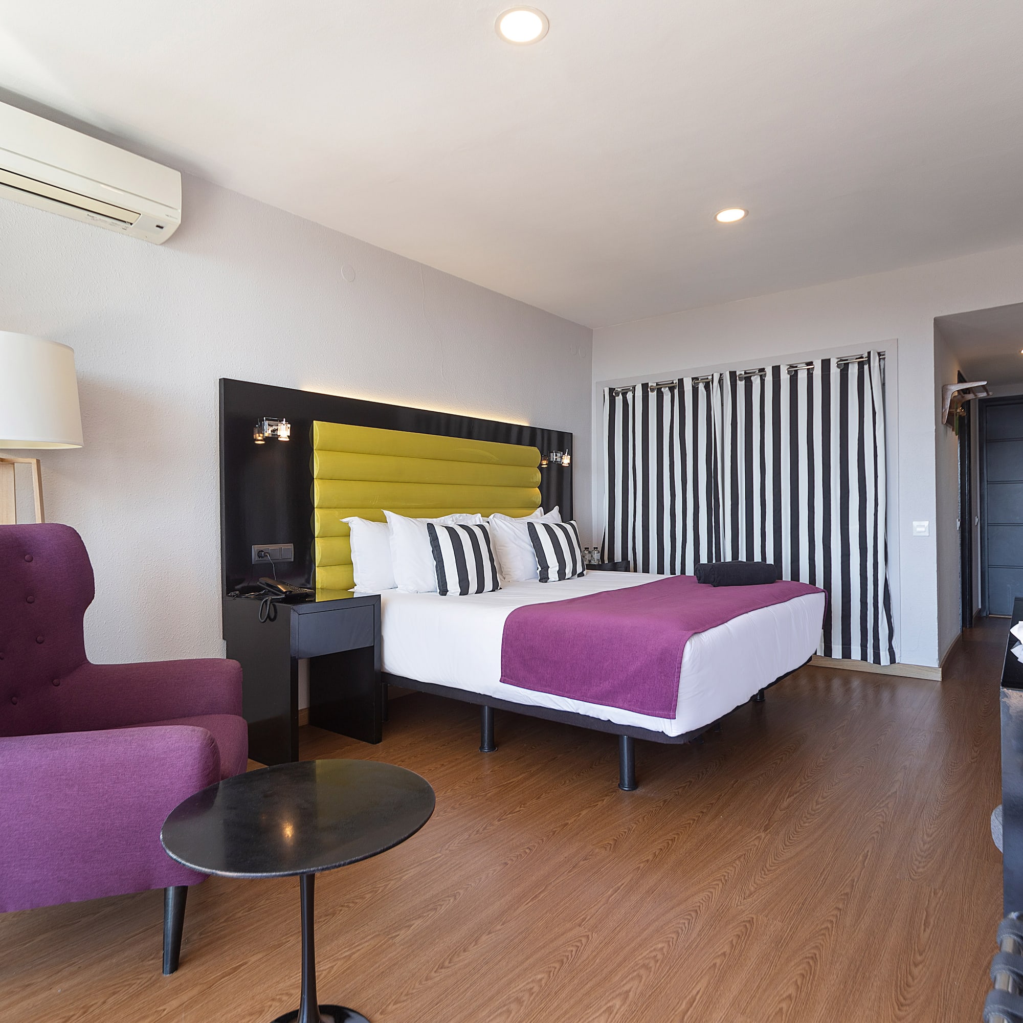 a room with a bed and a chair