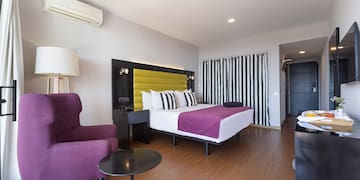 a room with a bed and a chair