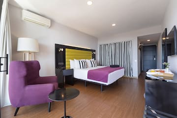 a room with a bed and a chair