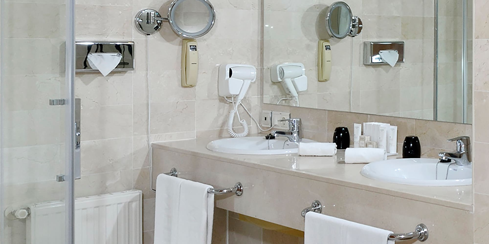 a bathroom with a shower and sink