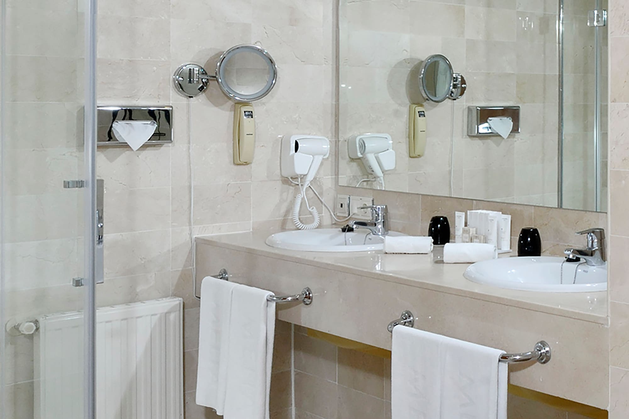 a bathroom with a shower and sink