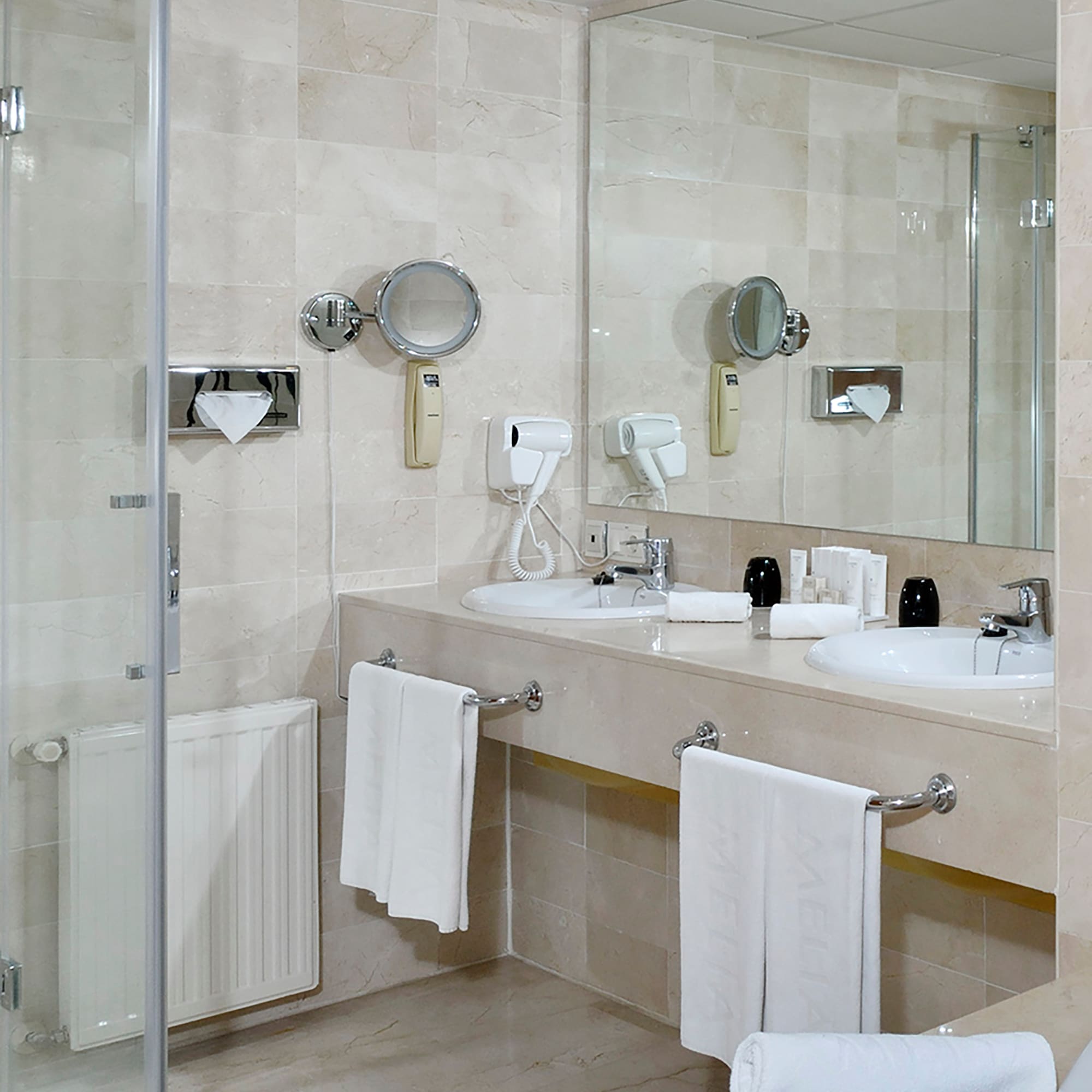 a bathroom with a shower and sink