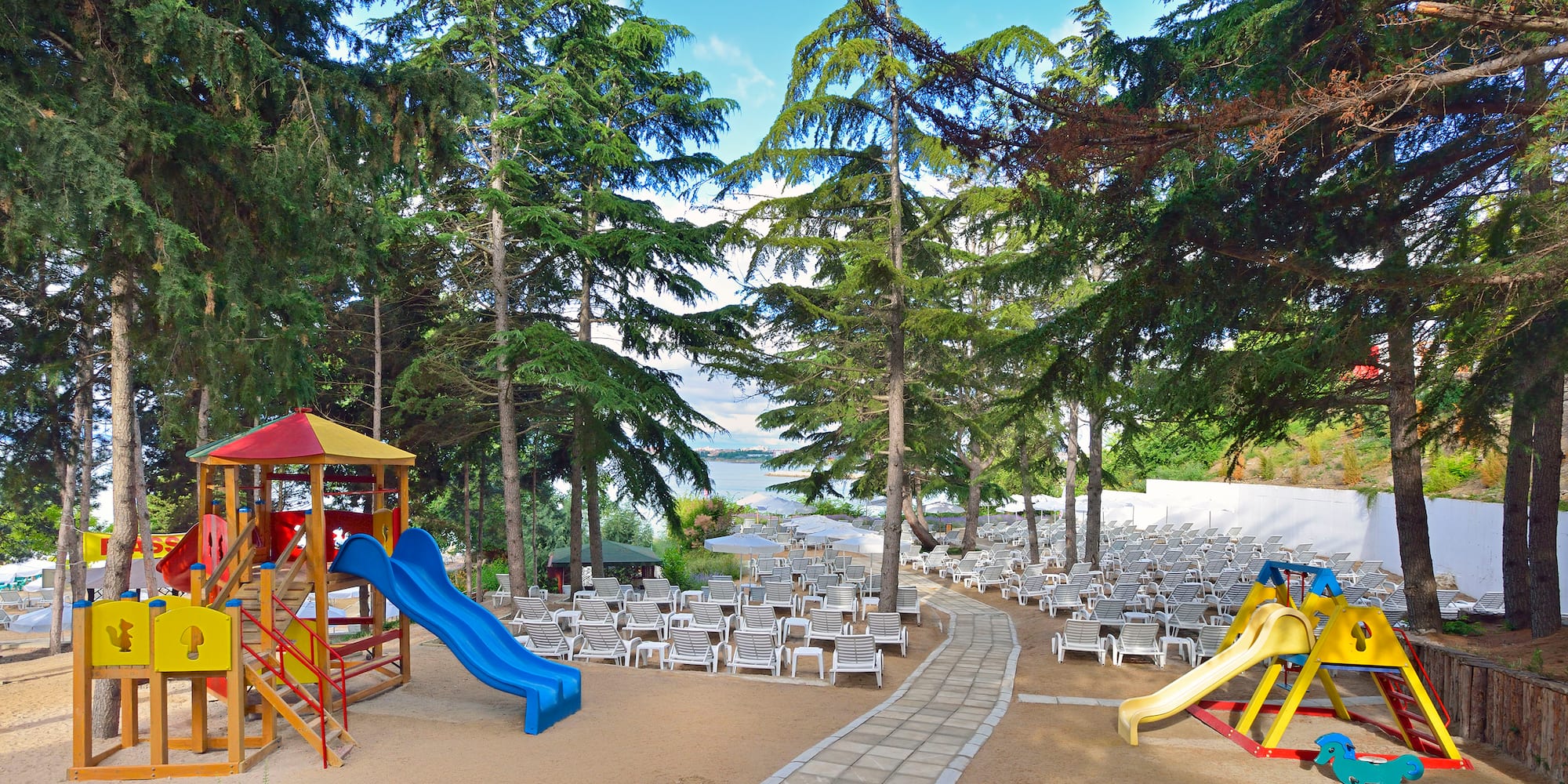 a playground with chairs and a beach chair