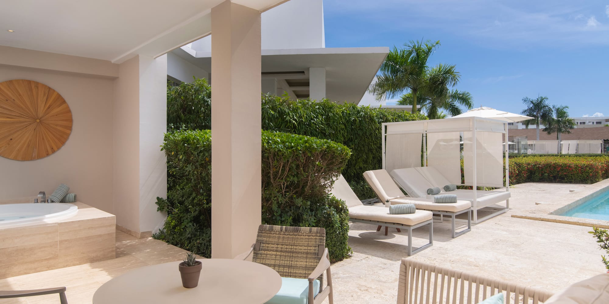 a patio with chairs and a table