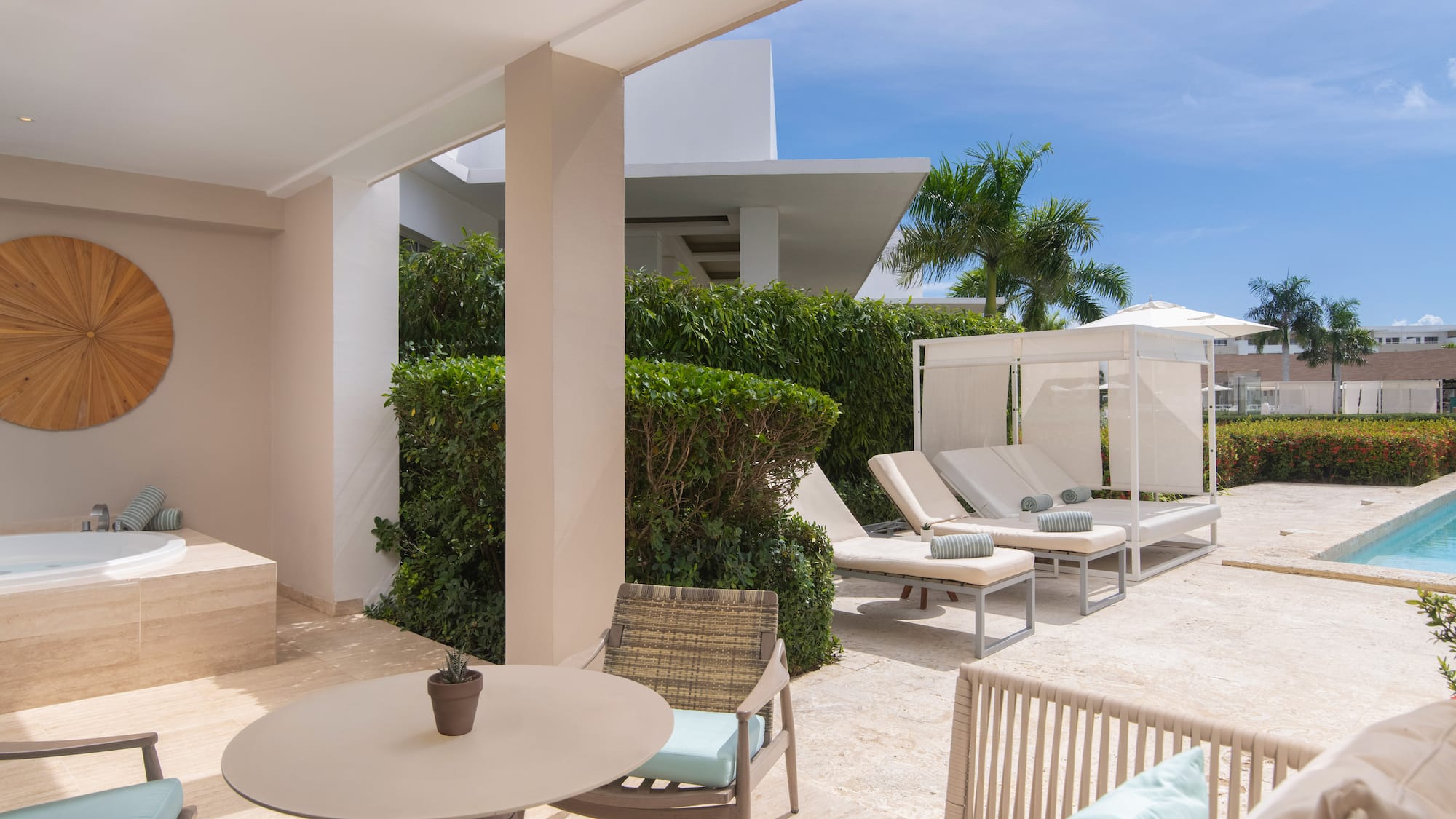 a patio with chairs and a table