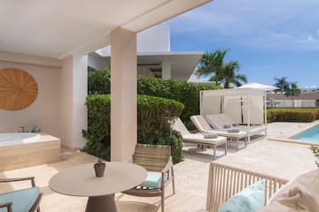 a patio with chairs and a table