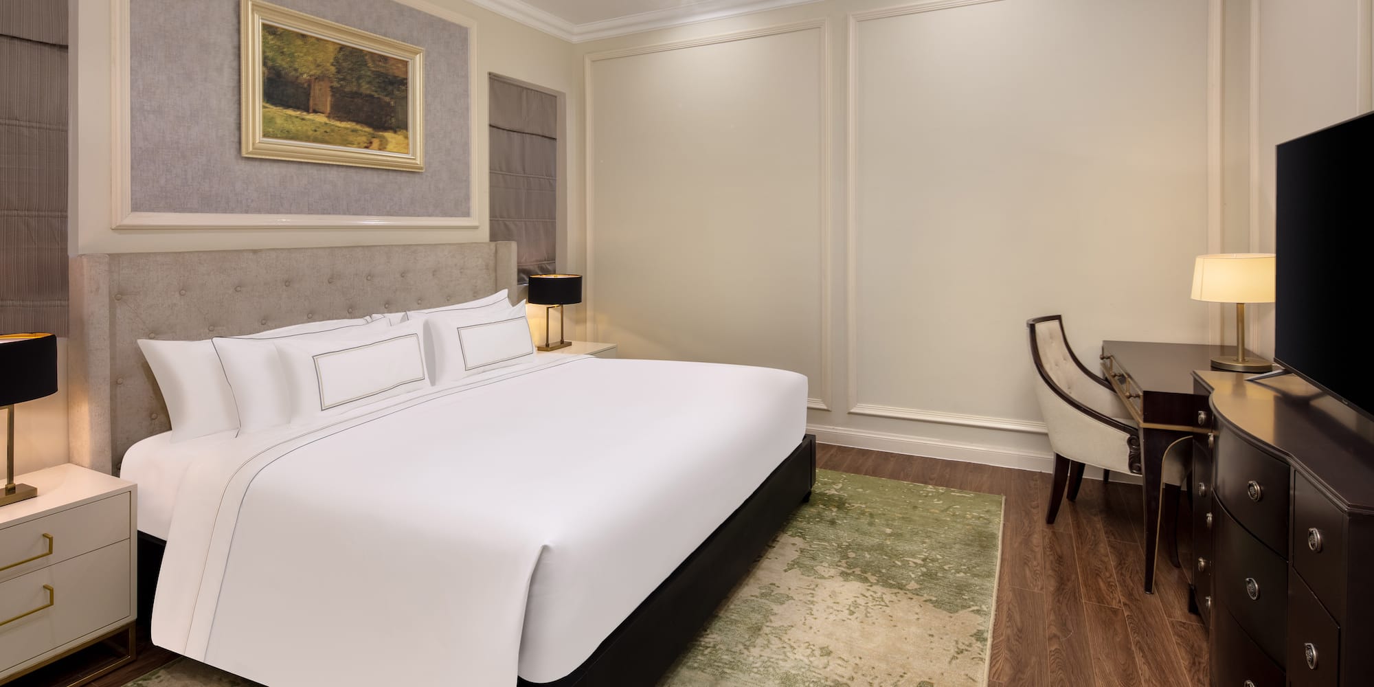 a bedroom with a bed and a desk