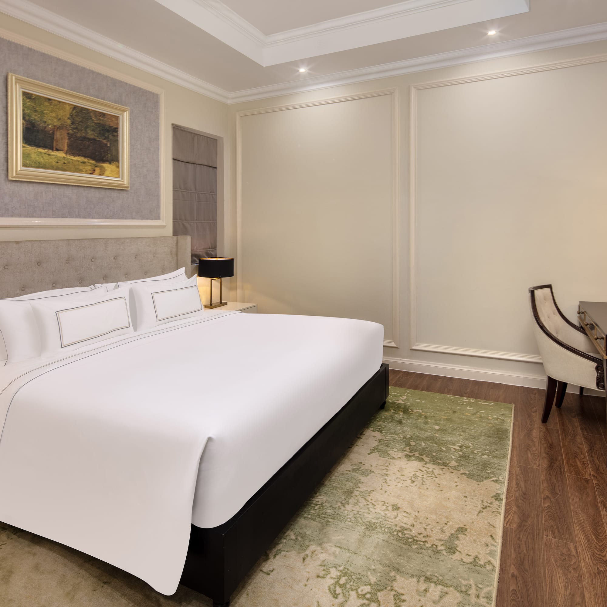 a bedroom with a bed and a desk