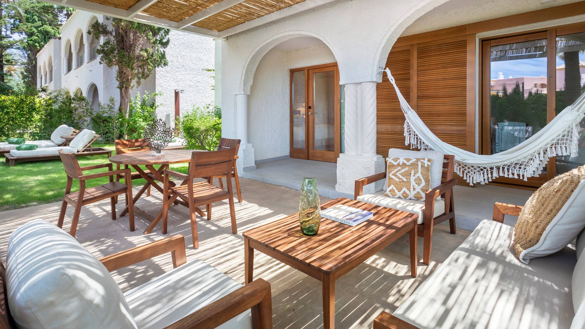 a patio with chairs and tables