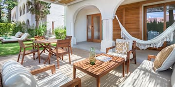 a patio with chairs and tables