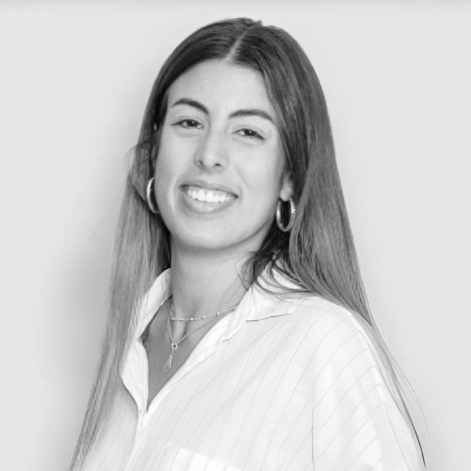 a woman smiling with long hair