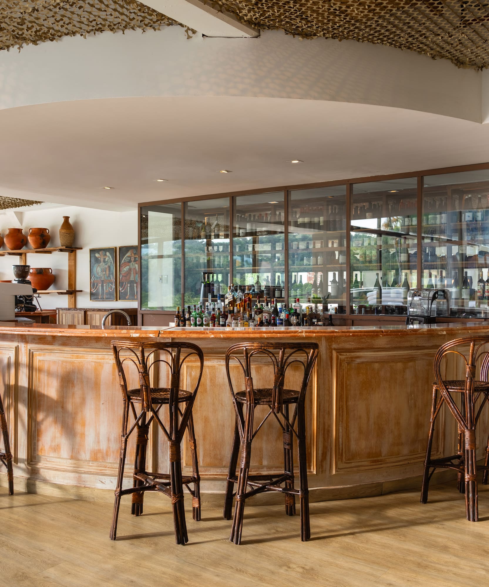 a bar with chairs and a counter