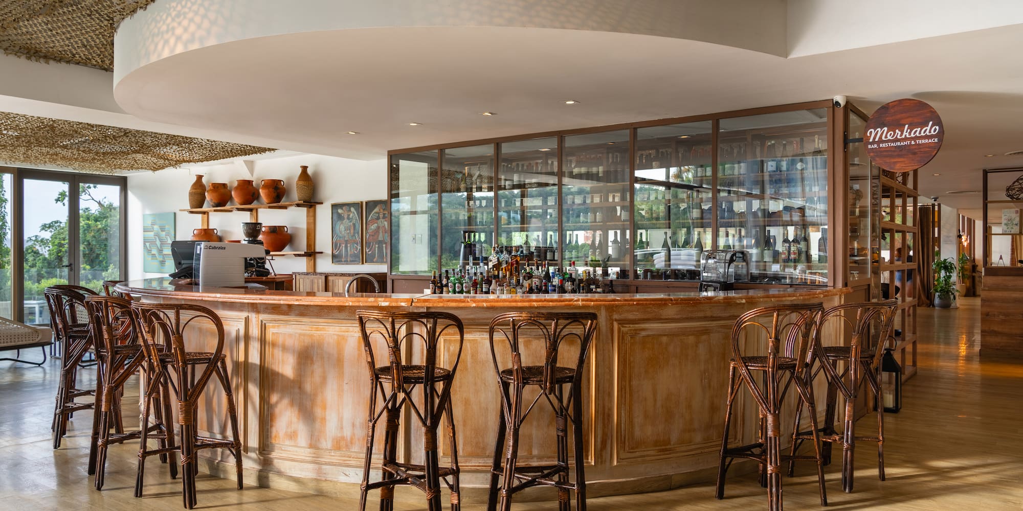 a bar with chairs and a counter