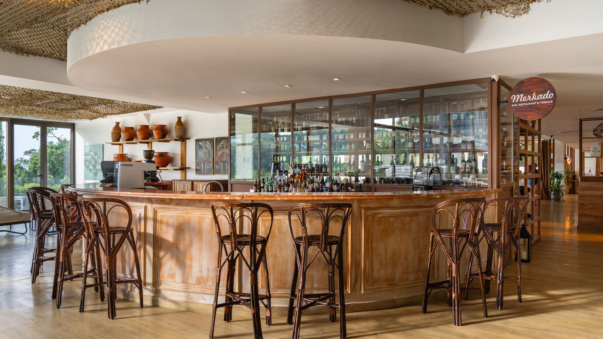 a bar with chairs and a counter
