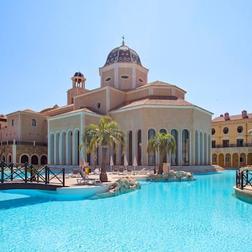 a building with a pool in front of it