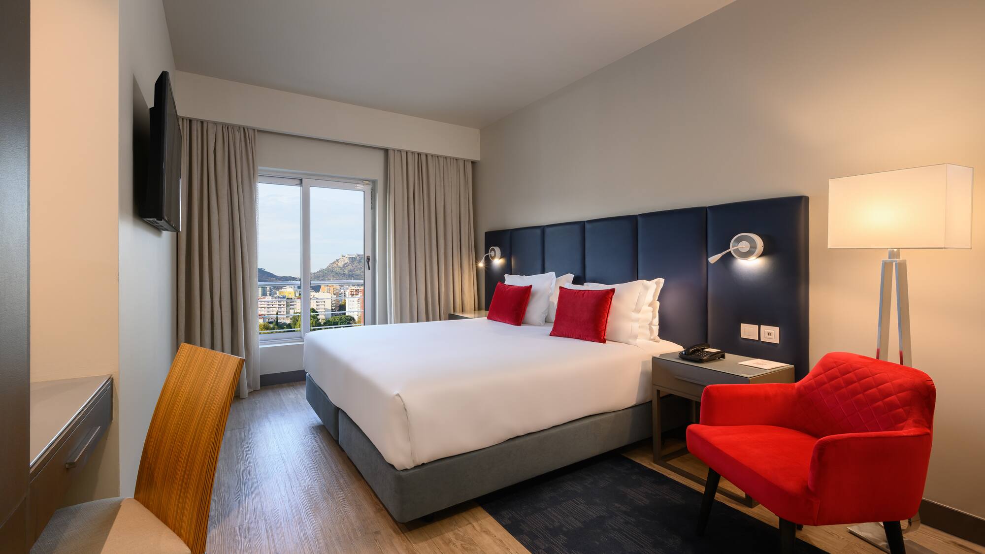 a room with a bed and a chair