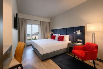 a room with a bed and a chair