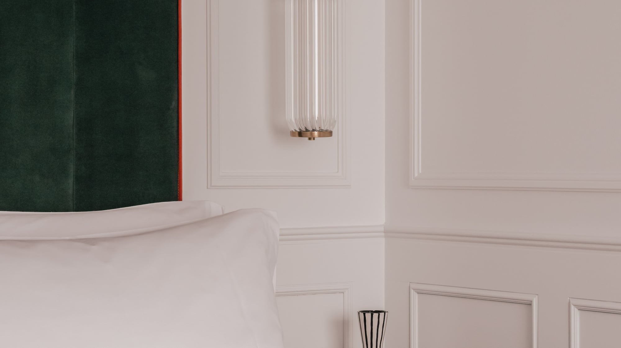 a bed with pillows and a curtain