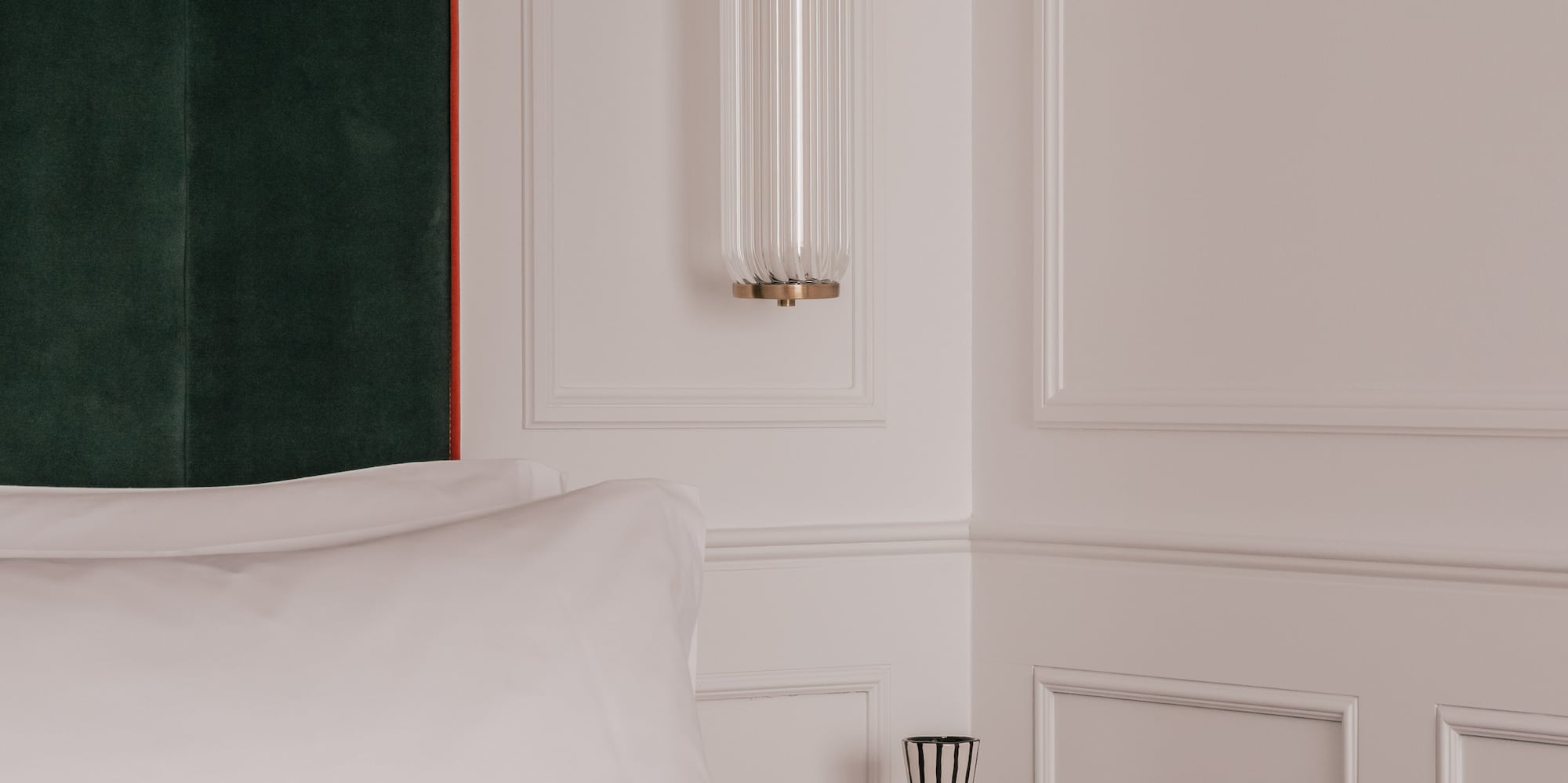 a bed with pillows and a curtain