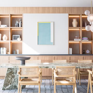 a dining room with a table and chairs