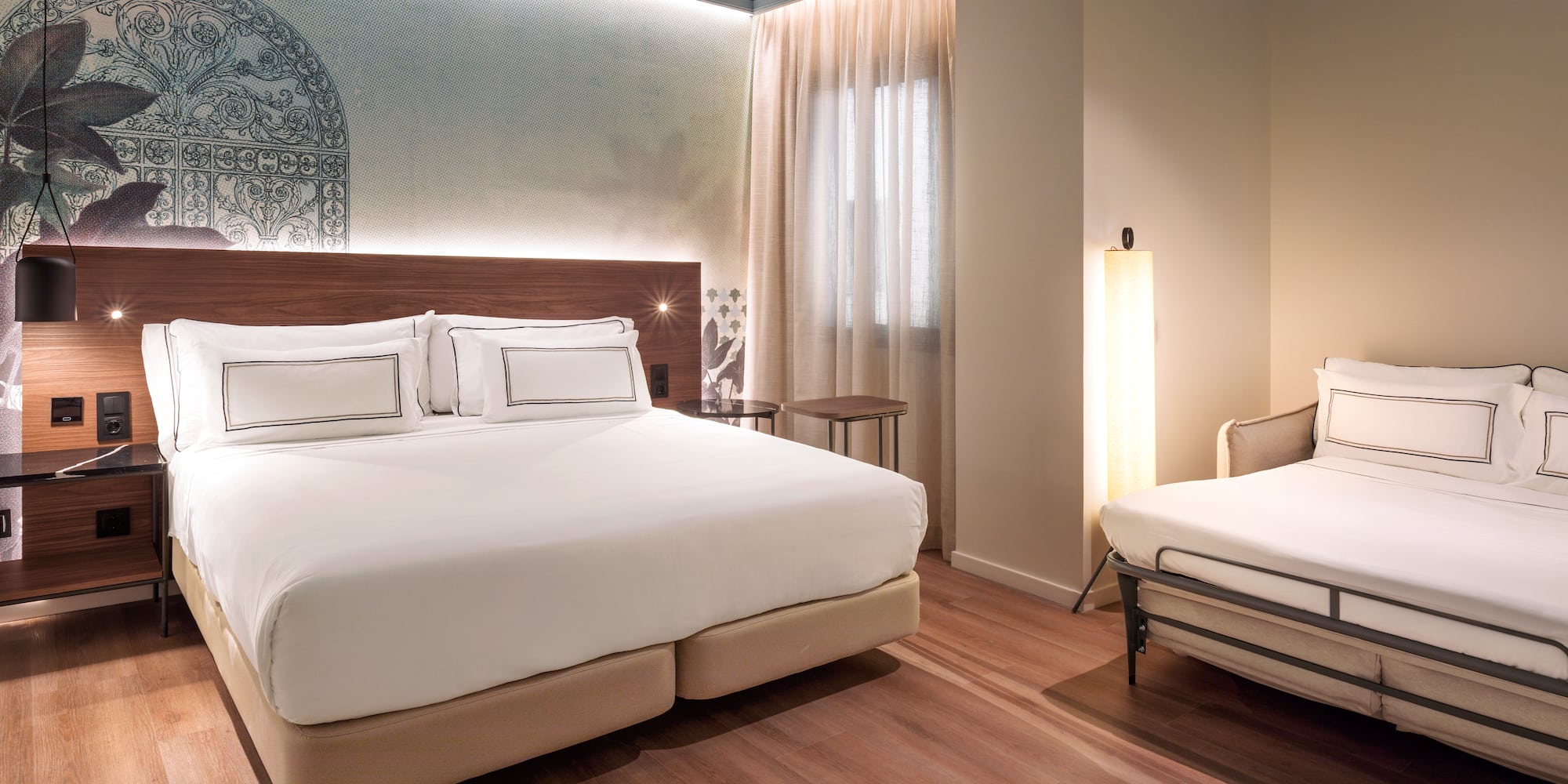 a room with a bed and a lamp