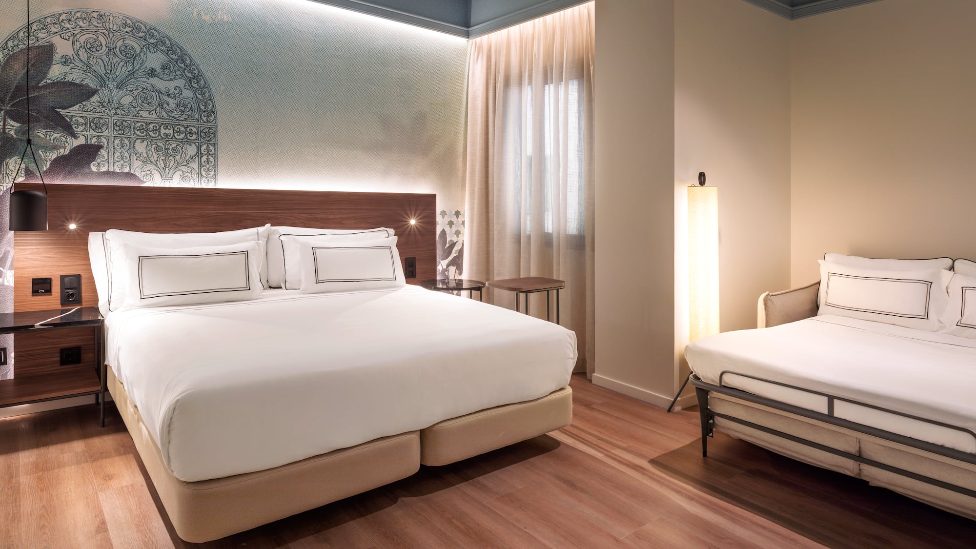 a room with a bed and a lamp