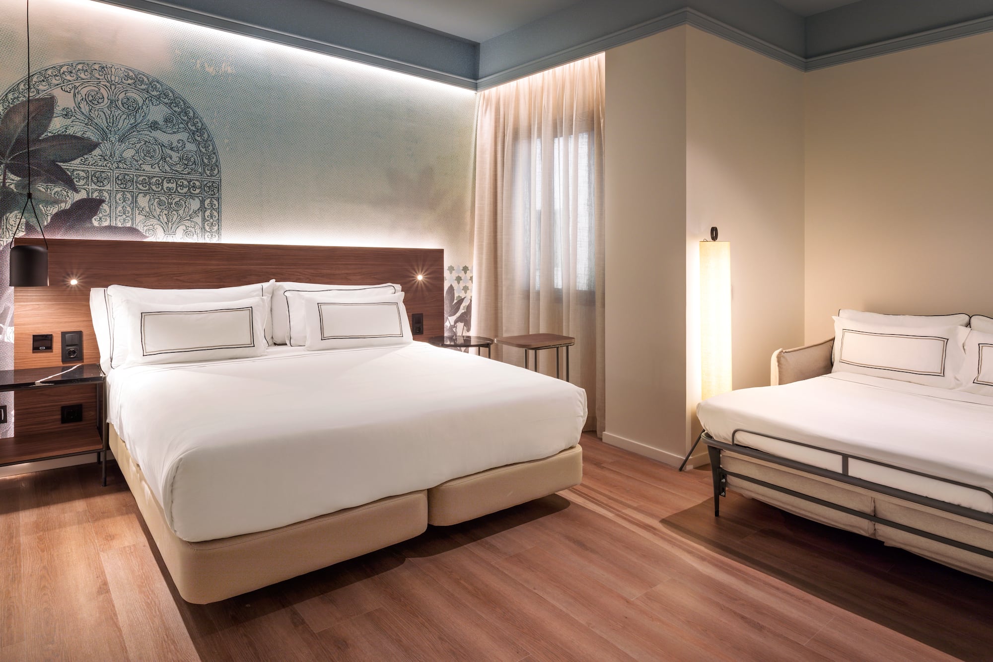 a room with a bed and a lamp