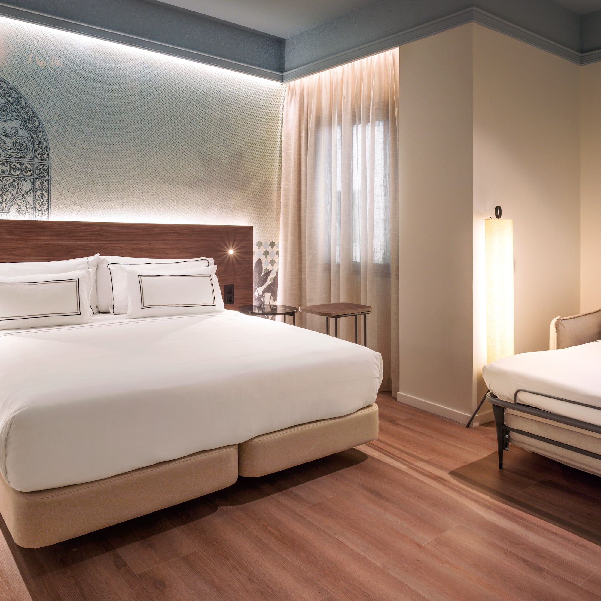 a room with a bed and a lamp