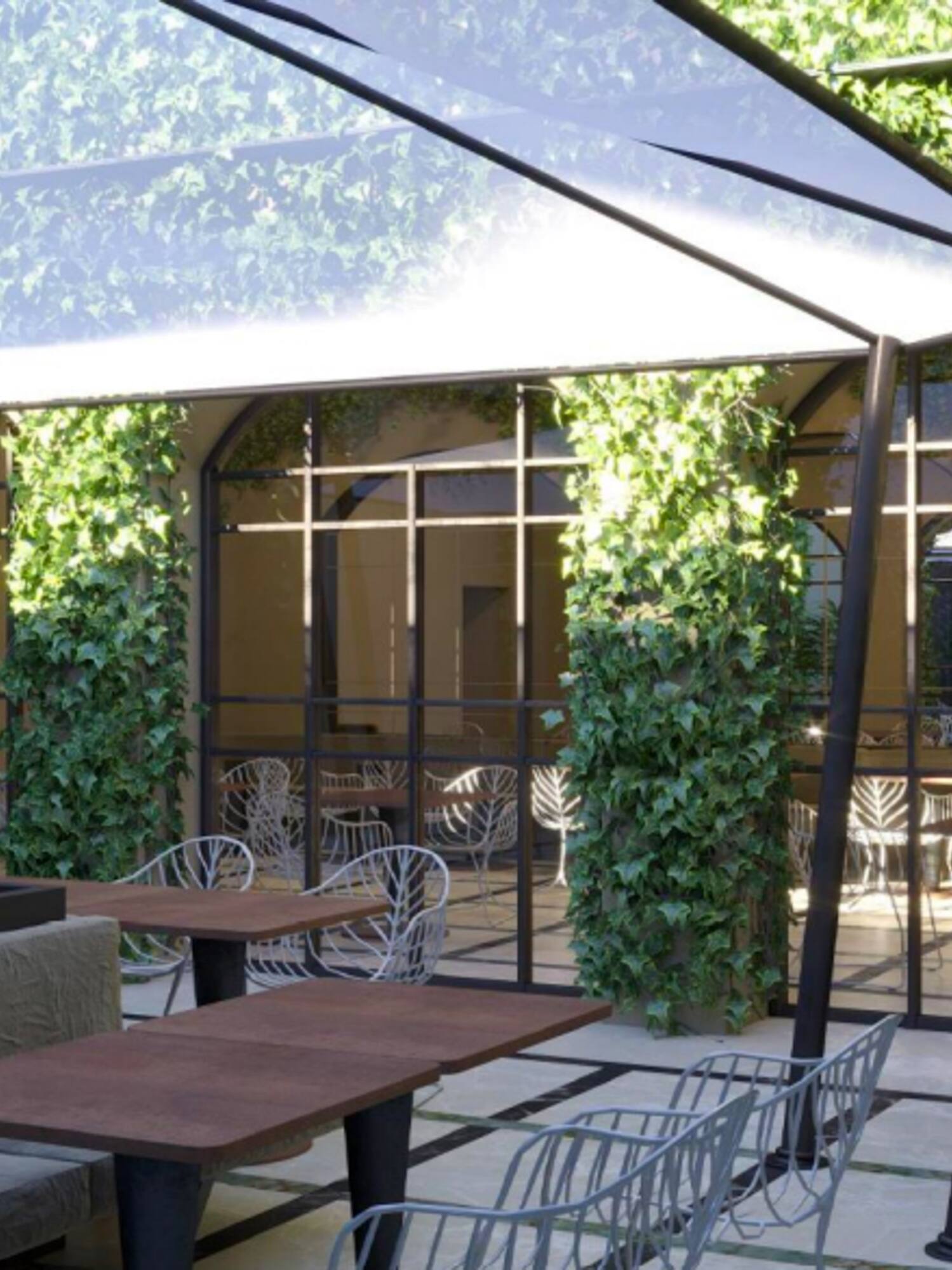 a patio with tables and chairs