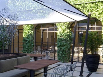 a patio with tables and chairs