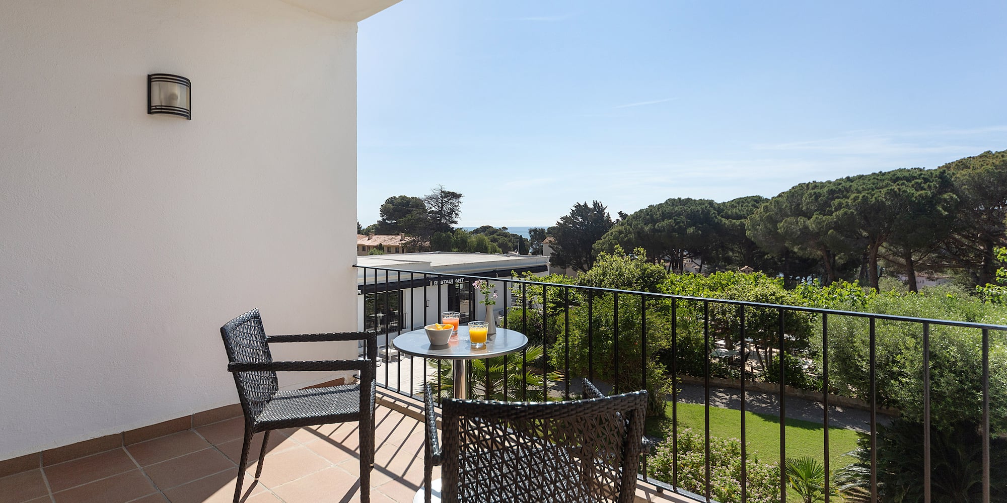 a table and chairs on a balcony