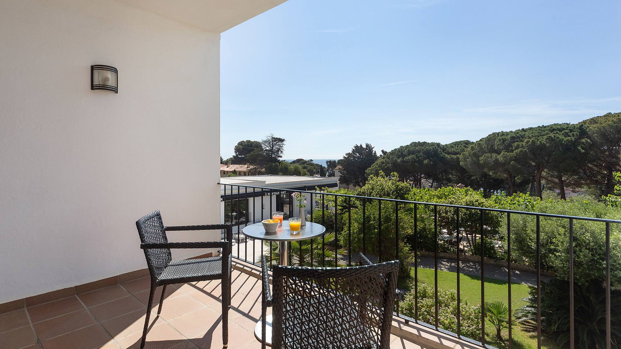 a table and chairs on a balcony